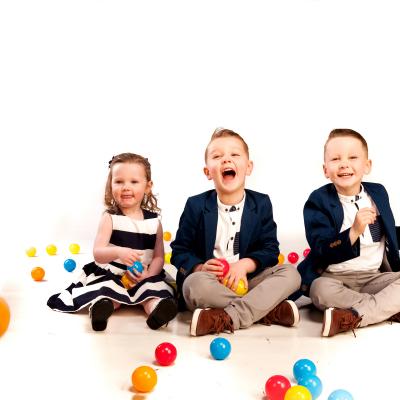 3 small children throwing balls