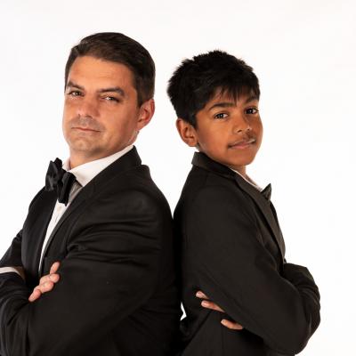 Dad and son back to back in Tux