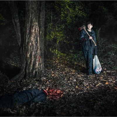A faked image of two brothers, one has murdered the other in a horror style. 