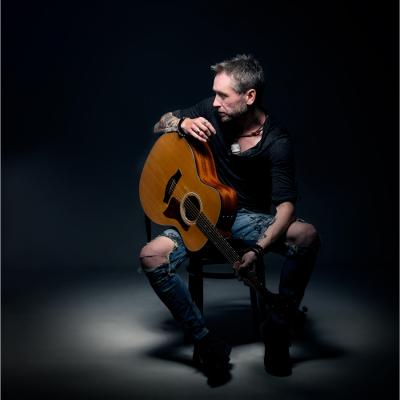 Ash Sooper Sat With A Guitar