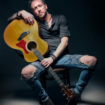 Ash Sooper Sat With A Guitar